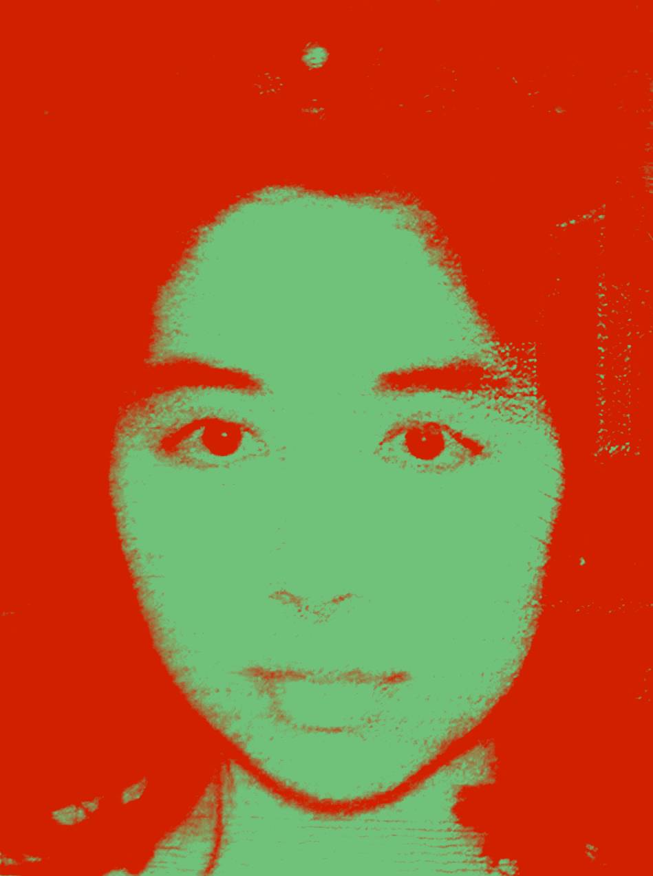 High-contrast image of Mylvaganam looking directly into camera